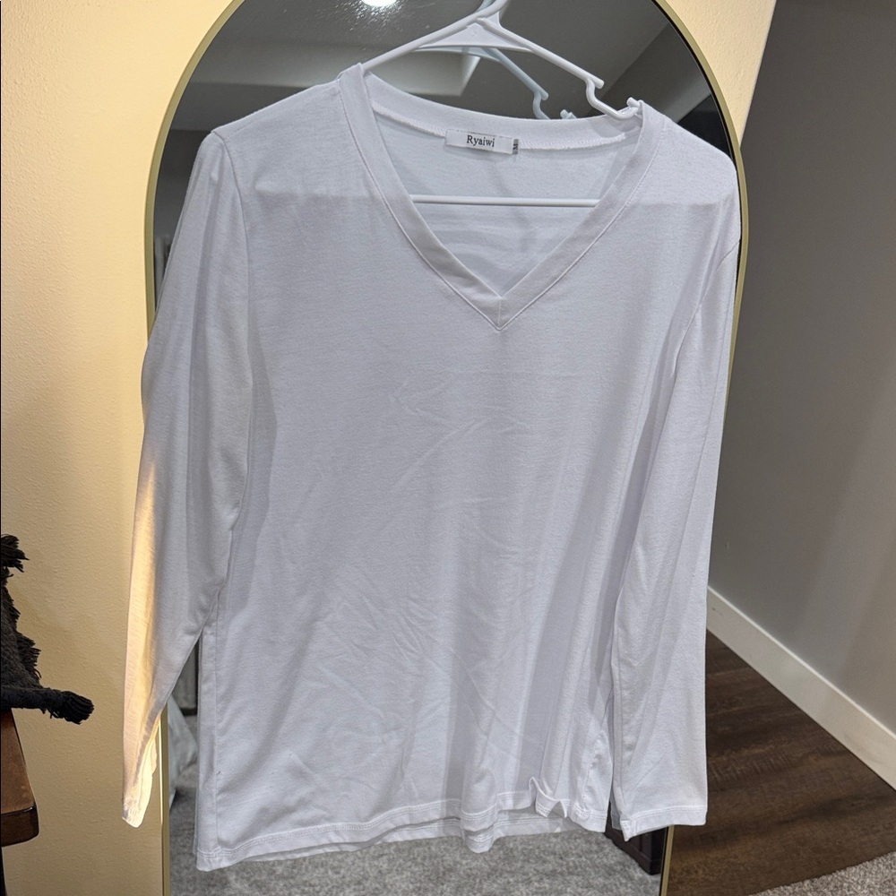Long sleeve tee, V-neck, soft size medium is 35% rayon 60% polyester 5% spandex